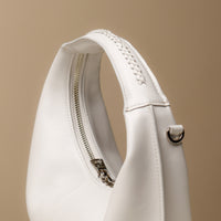 Close up view of Soft Rounded Bag crescent leather top-handle handbag