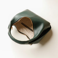 Open interior of green Soft Rounded Bag crescent leather top-handle handbag