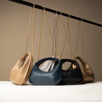 A collection of all variants of Soft Rounded Bag crescent leather top-handle handbag