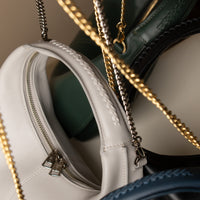 Close up view of all Soft Rounded Bag crescent leather top-handle handbag