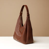 Side view of Mia Minimale Sr. handcrafted luxury leather hobo bag