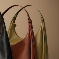 Close up view of three Mia Minimale Sr. handcrafted luxury leather hobo bag
