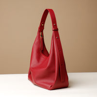 Side view of red Mia Minimale Sr. handcrafted luxury leather hobo bag
