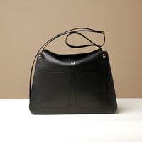 black leather soft structured quiet luxury leather bag