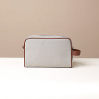 Back View of grey Fabricio leather toiletry bag with roomy interior and organized compartments, perfect for travel or everyday storage of essentials