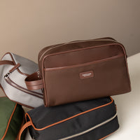 Close Up of Brown Fabricio leather toiletry bag with roomy interior and organized compartments, perfect for travel or everyday storage of essentials with other variants