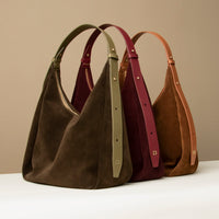 Lineup of Suede Mia Minimale bags in olive, burgundy, and tan – soft hobo handbags with structured leather straps