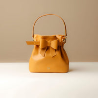 Front view of yellow Premium leather Sandy Bag with shoulder strap