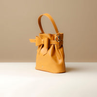 Side view of yellow Premium leather Sandy Bag with shoulder strap