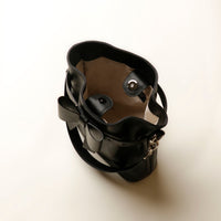 Top view of open black Premium leather Sandy Bag with shoulder strap