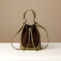 Front view of Green Suede Tulipa Bag in smooth suede with drawstring closure