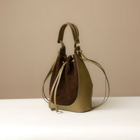 Side view of Green Suede Tulipa Bag showing structured leather front