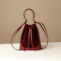 Front view of Red Suede Tulipa Bag in smooth suede with drawstring closure