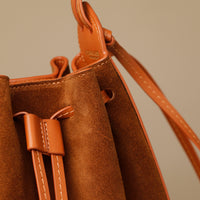 Close-up of drawstring tie on Suede Tulipa Bag