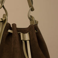 Close-up of drawstring tie on Green Suede Tulipa Bag