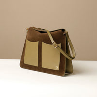 Side view of Olive Suede Penelope Sr. bag in Brown with fold-over magnetic closure