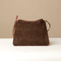 Back view of Brown Suede Penelope Sr. bag in Brown with fold-over magnetic closure