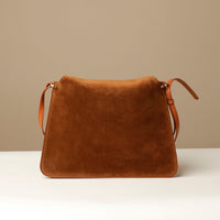 Back view of Suede Penelope Sr. bag in Brown with fold-over magnetic closure