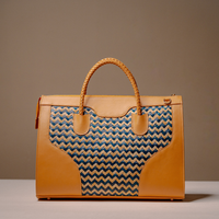Back View of Luxury Eva Sofia Bag with leather trim, natural fiber weave, and adjustable shoulder strap