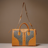 Full view of Luxury Eva Sofia Bag with leather trim, natural fiber weave, and adjustable shoulder strap
