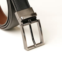 Close‑up of dual finish leather belt and buckle detail