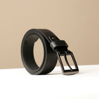 A black leather belt with a metal buckle, displayed against a neutral background.