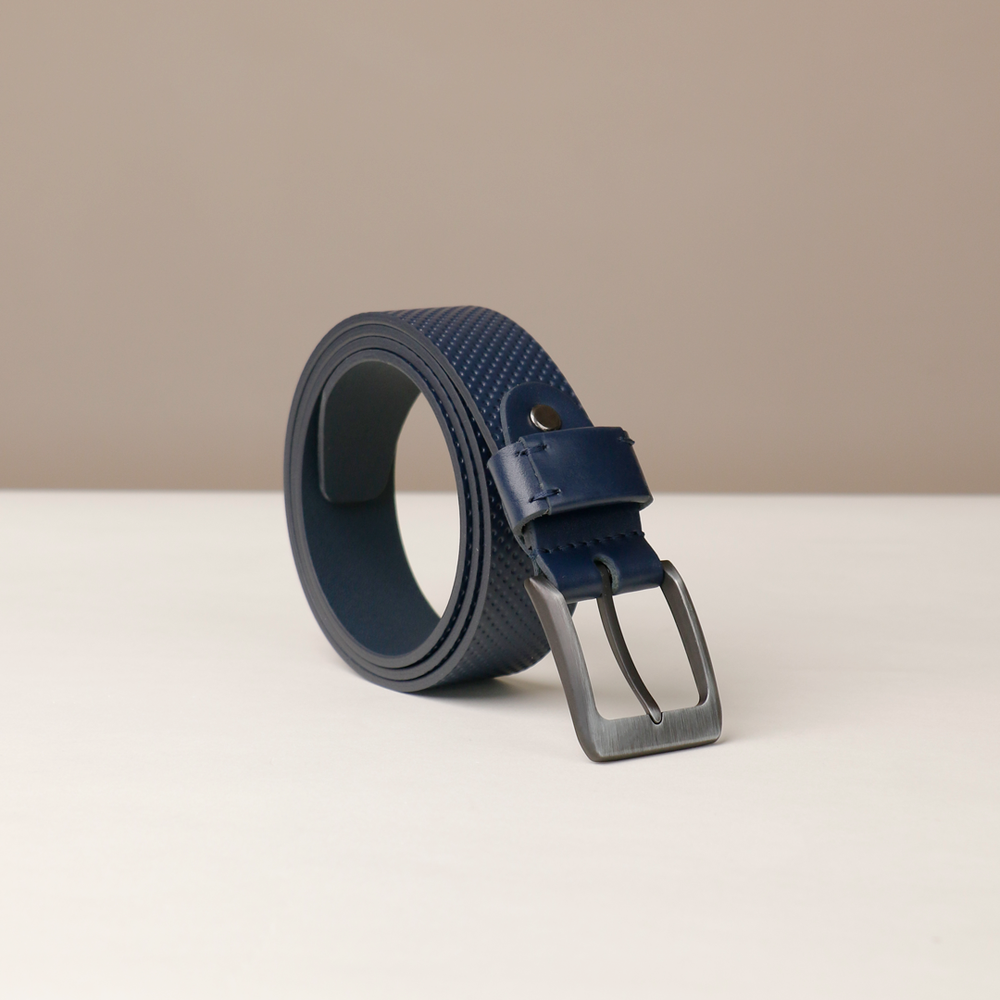 Blue belt with a silver buckle on a beige background