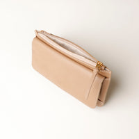 Beige wallet with gold zipper on a white background