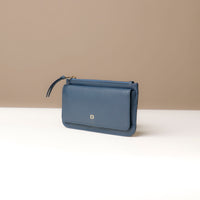 Blue leather wallet with a simple design on a neutral background