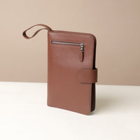 Globetrotters Document Holder palisander brown leather with silver hardware, with a brown strap
