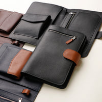 A group of Globetrotters Document Holders in a variety colors, made with premium pebble leather
