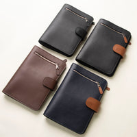 Four Globetrotters Document Holder, one brown, one navy with tan, one black and another black with tan, craft with premium leather