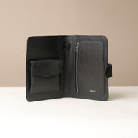 An open globetrotters Document Holder black with silver hardware, with compartments for documents