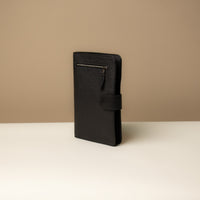 Globetrotters Document Holder black pebbled leather with silver hardware, lateral view