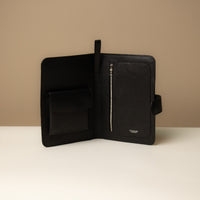 Open view of a Globetrotters Document Holder black pebbled leather with silver hardware