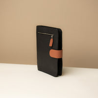 Globetrotters Document Holder black and tan pebbled leather with gold hardware, lateral view