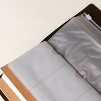 Close Up View of Open Terra concept notebook with premium leather cover and refillable pages, perfect for journaling, sketching, travel memories, or creative ideas.