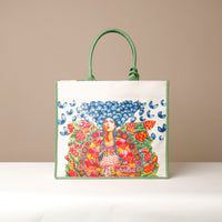 Front view of green Mercatto Tote Bag with double leather handles and woven detail