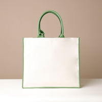 Back view of green Mercatto Tote Bag with double leather handles and woven detail