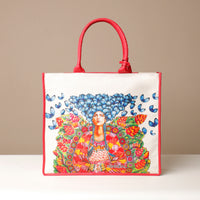 Front view of red Mercatto Tote Bag with double leather handles and woven detail