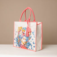 Side view of pink Mercatto Tote Bag with double leather handles and woven detail