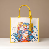 Front view of yellow Mercatto Tote Bag with double leather handles and woven detail