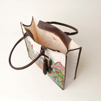 Top view of open brown Mercatto Tote Bag with double leather handles and woven detail