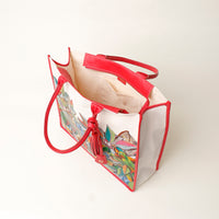 Top view of open red Mercatto Tote Bag with double leather handles and woven detail