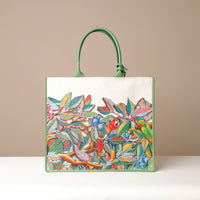 Front view of tote bags with multicolored floral prints, displayed against a neutral background.