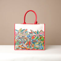 Front view of red Mercatto Tote Bag with double leather handles and woven detail
