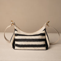Mini Mia 26 Raffia Arena handcrafted with raffia and premium leather, with gold hardware and a leather strap, in a beige background, back view