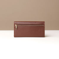 Brown leather wallet on a neutral background