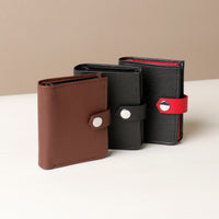 Three RFID card cases with snap closures, one in brown and one in black, displayed side by side.