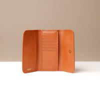 Brown leather wallet open to show interior compartments on a neutral background.